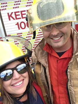 guy and gal in fire gear