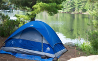 blue tent next to lake